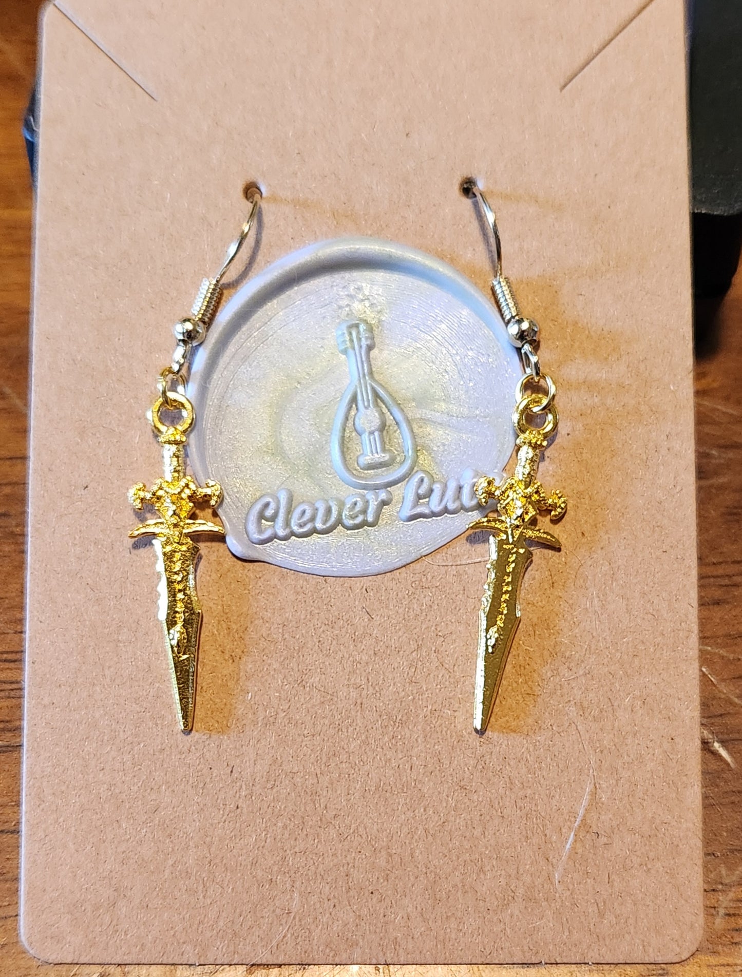 Gold dagger earrings