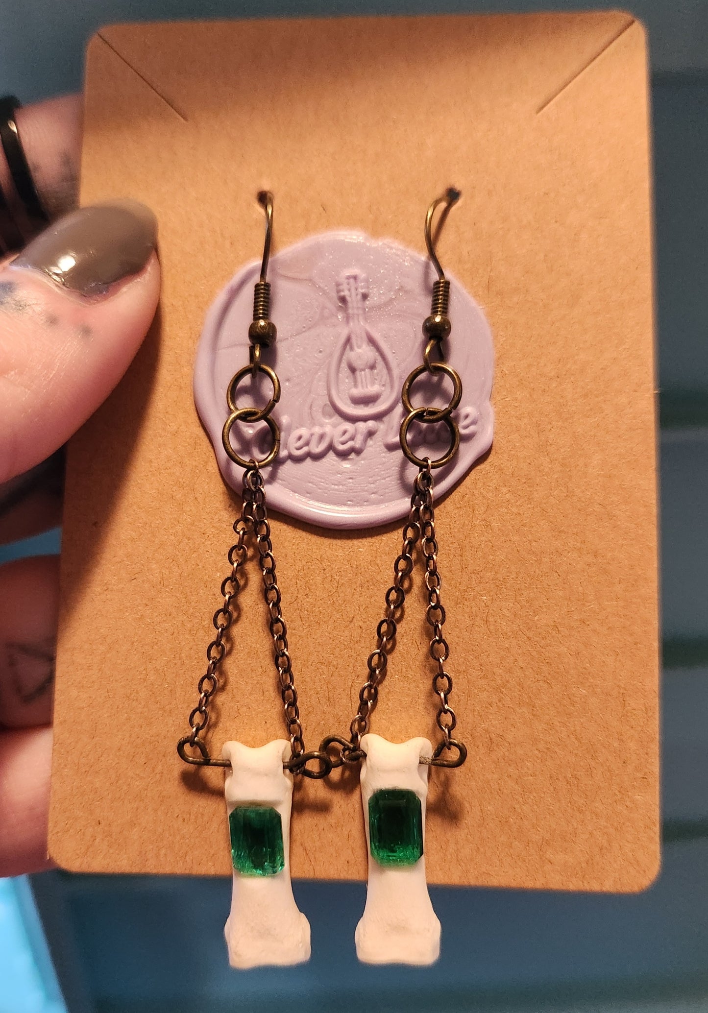 Emerald paw earrings
