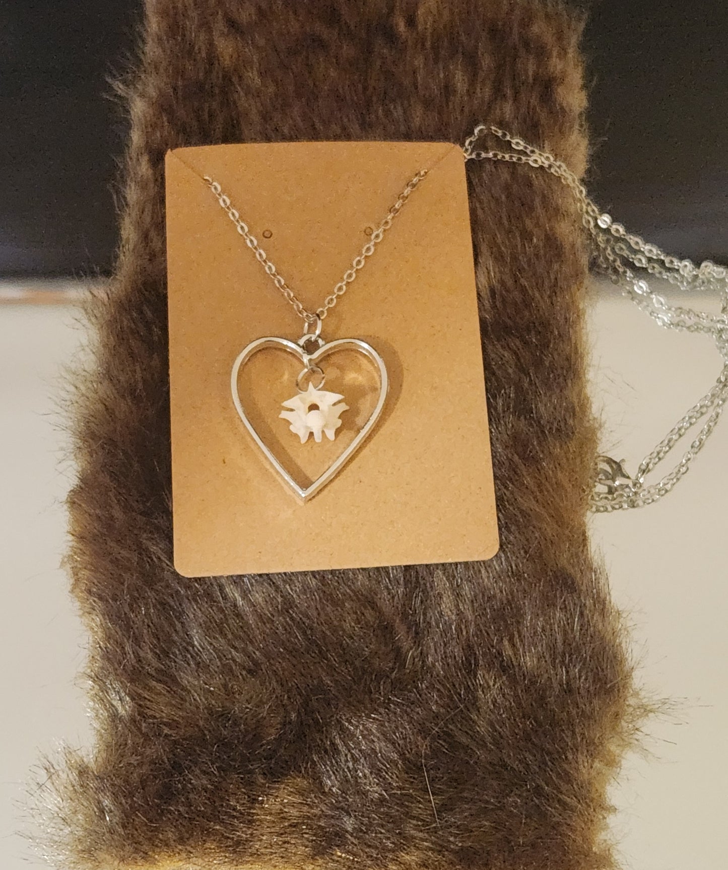 Suspended bone pendants