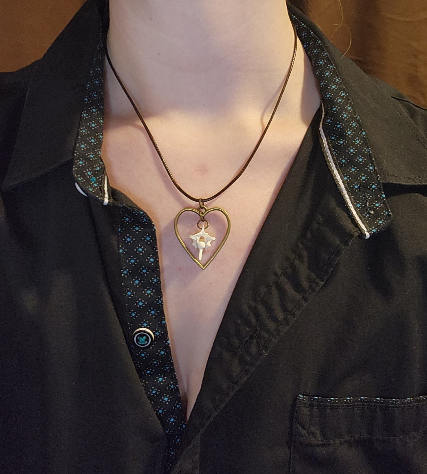 Suspended bone (leather cord)