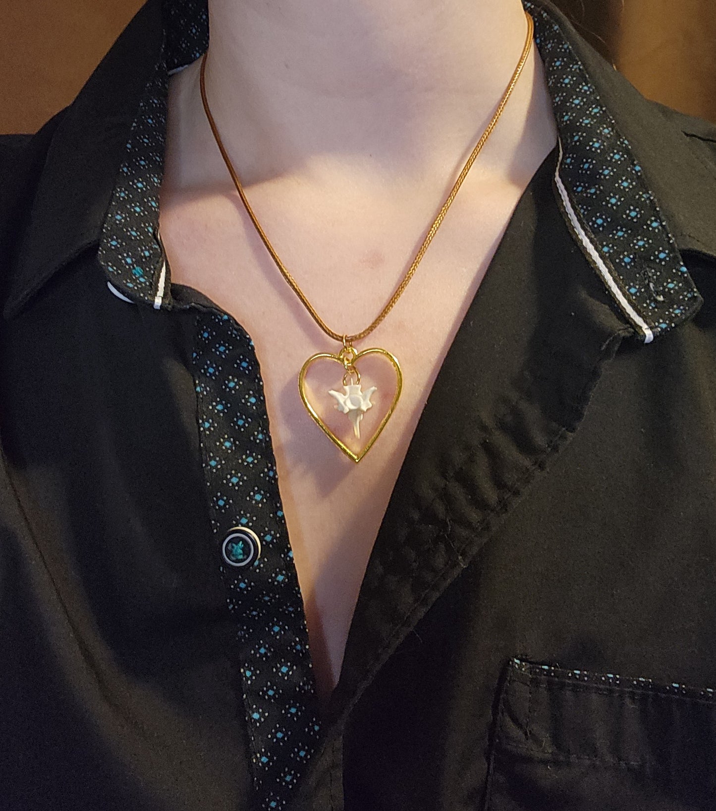 Suspended bone (leather cord)