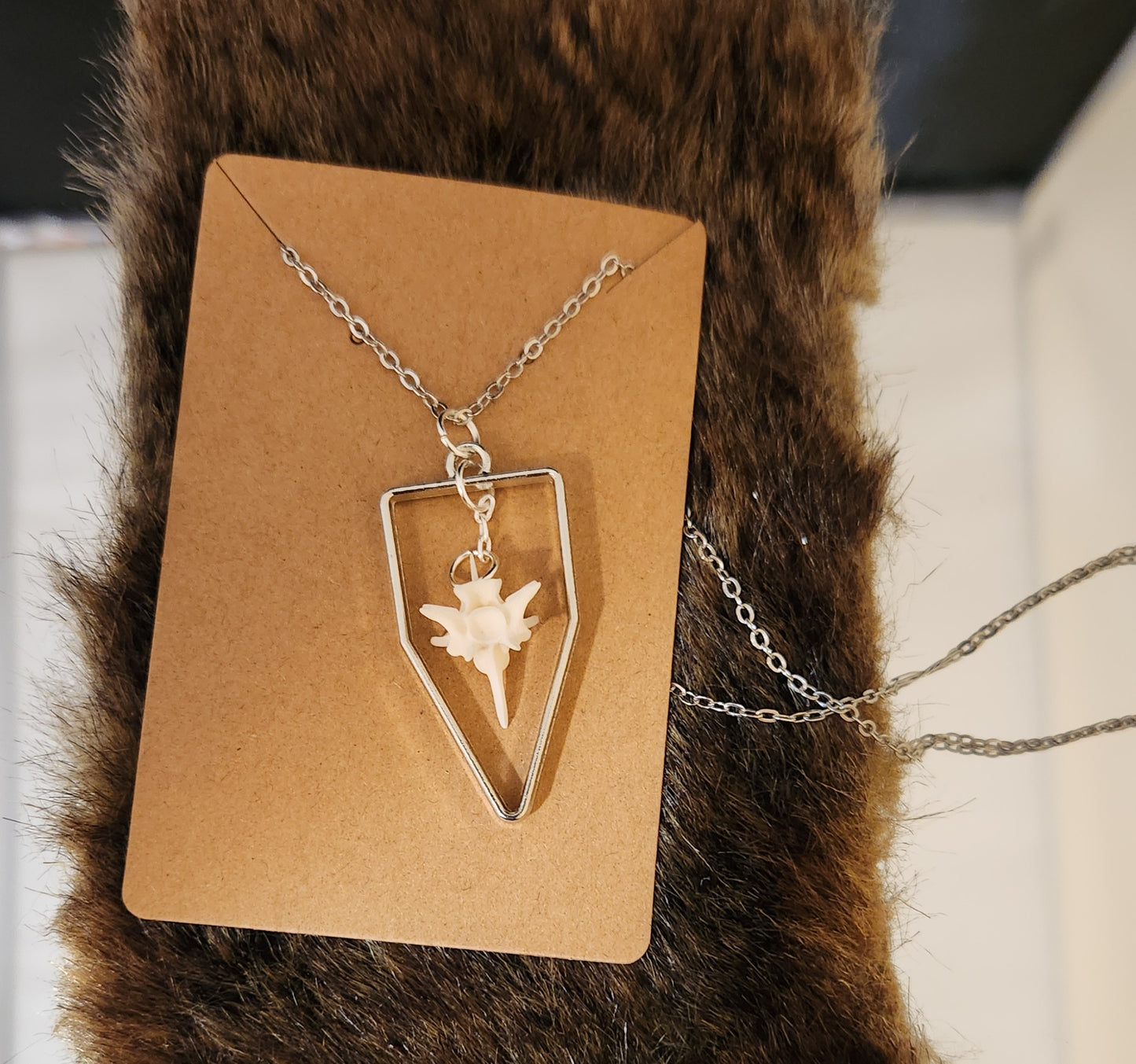 Suspended bone pendants