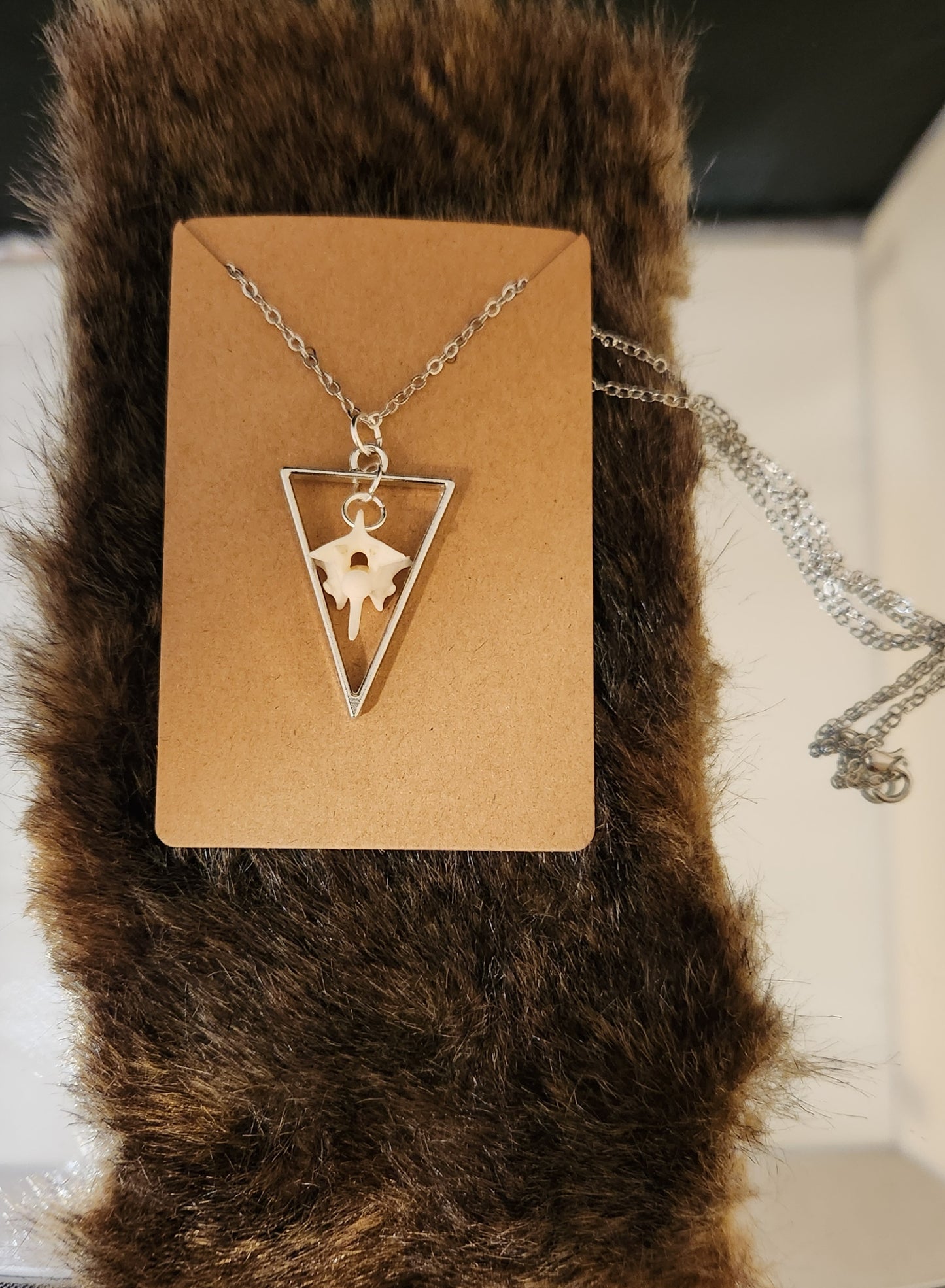 Suspended bone pendants